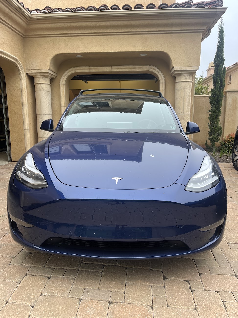 Dark blue Tesla Model Y before its mobile detail