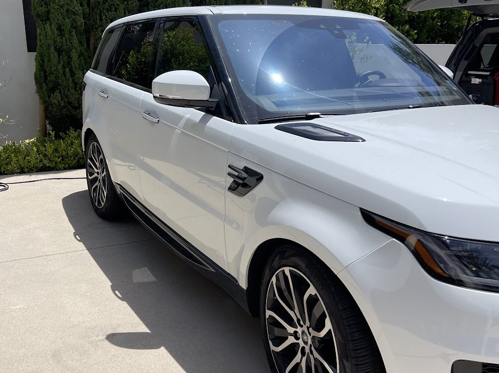 White SUV parked in a driveway after a full mobile detail