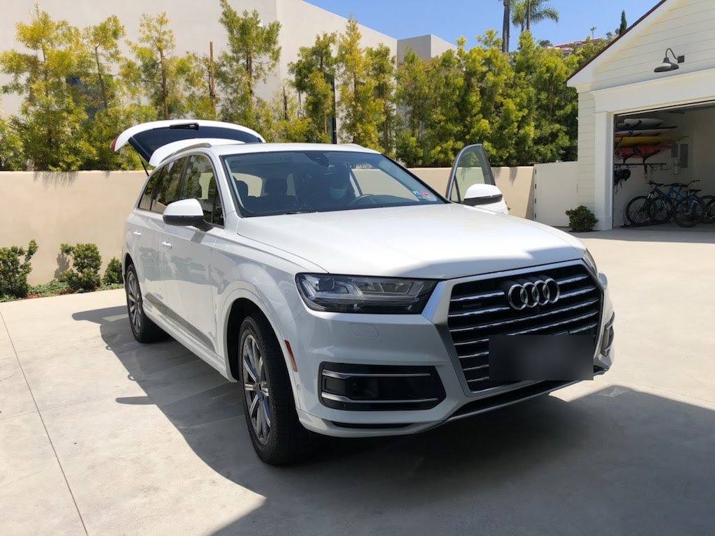 White Audi Q7 SUV in the driveway after a full mobile detail