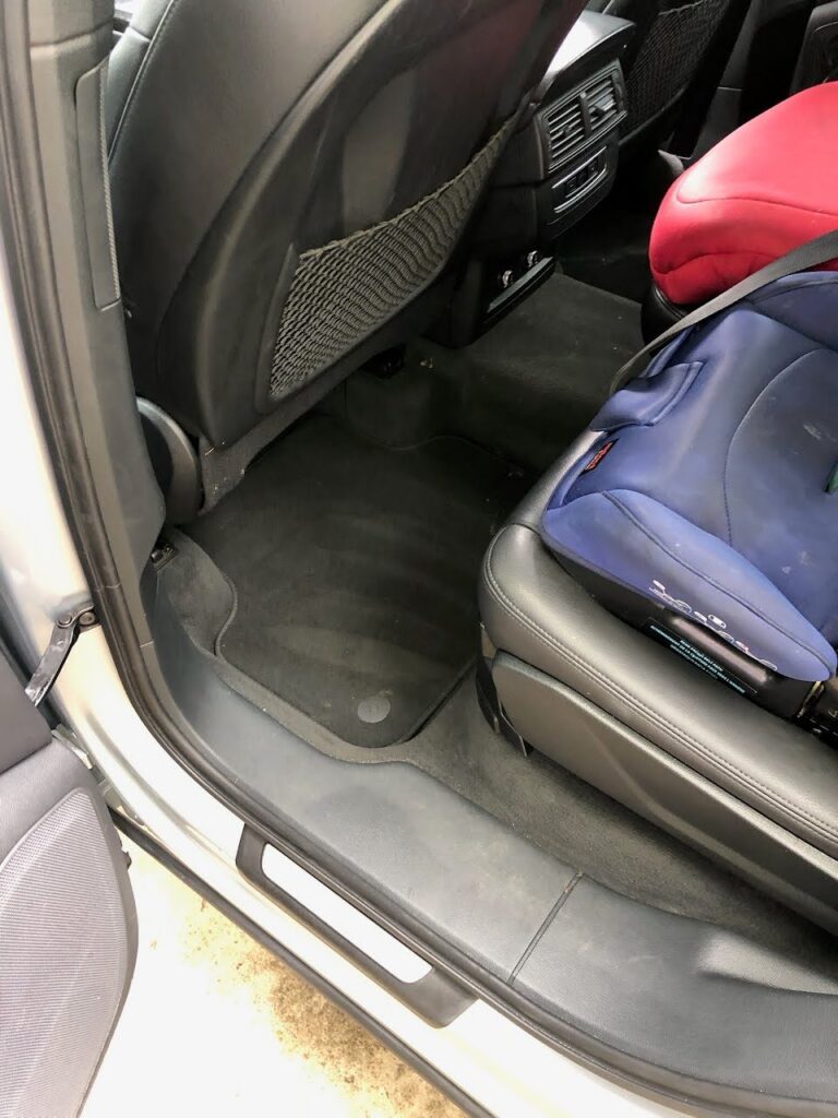Same family SUV back seat floor spotless after a full interior car detail in San Diego