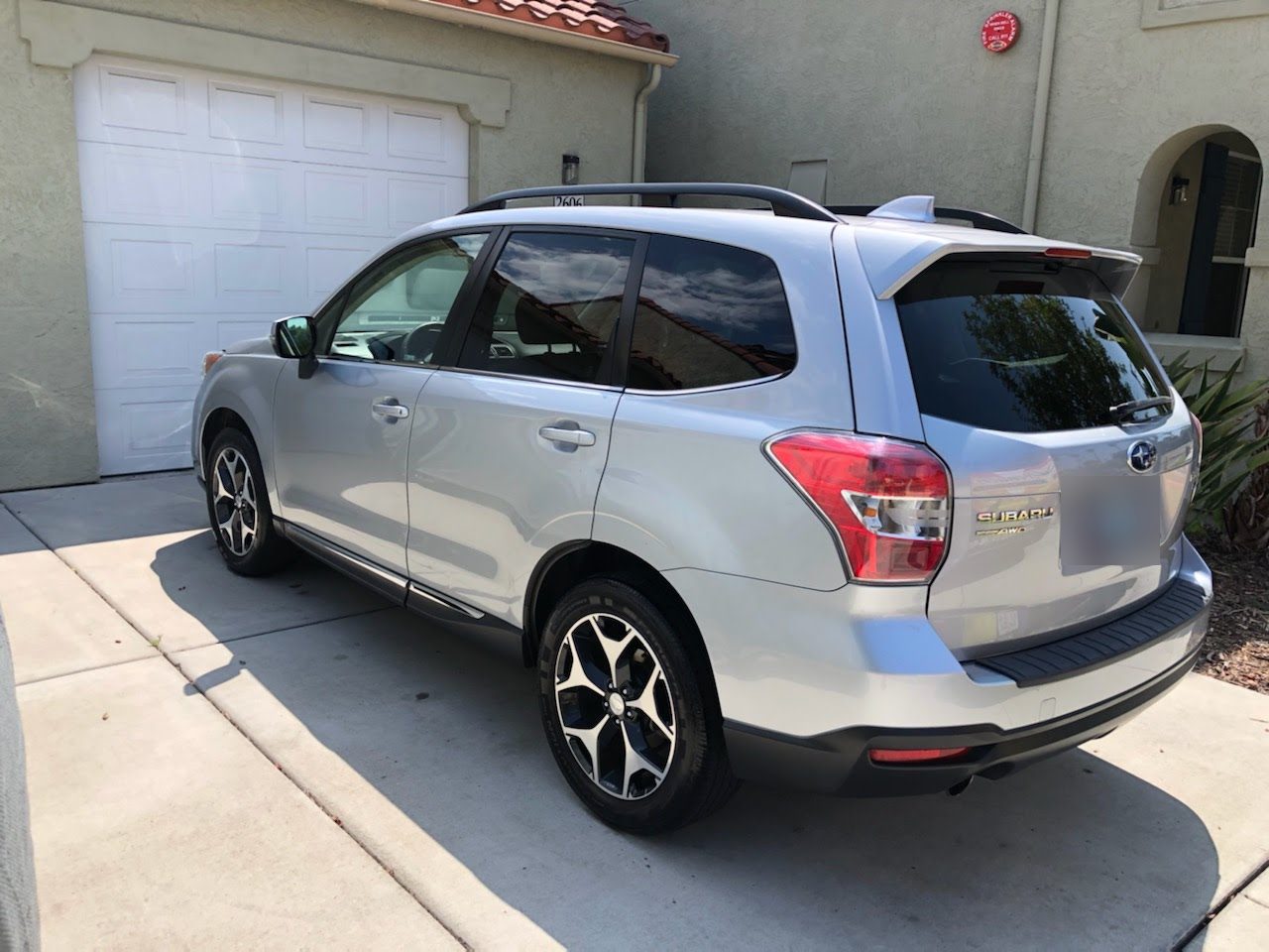 Subaru SUV after an exterior detail in a San Diego driveway